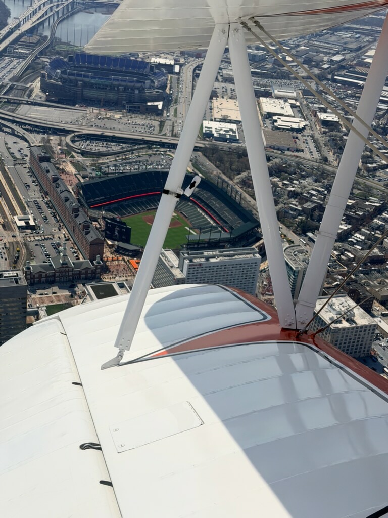 Camden Yards from the biplane towing a banner